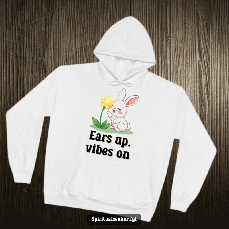 Funny joyful rabbit hoodie, featuring a rabbit happily sniffing a luminous flower. Offers warmth, comfort, and a touch of whimsical garden humor.