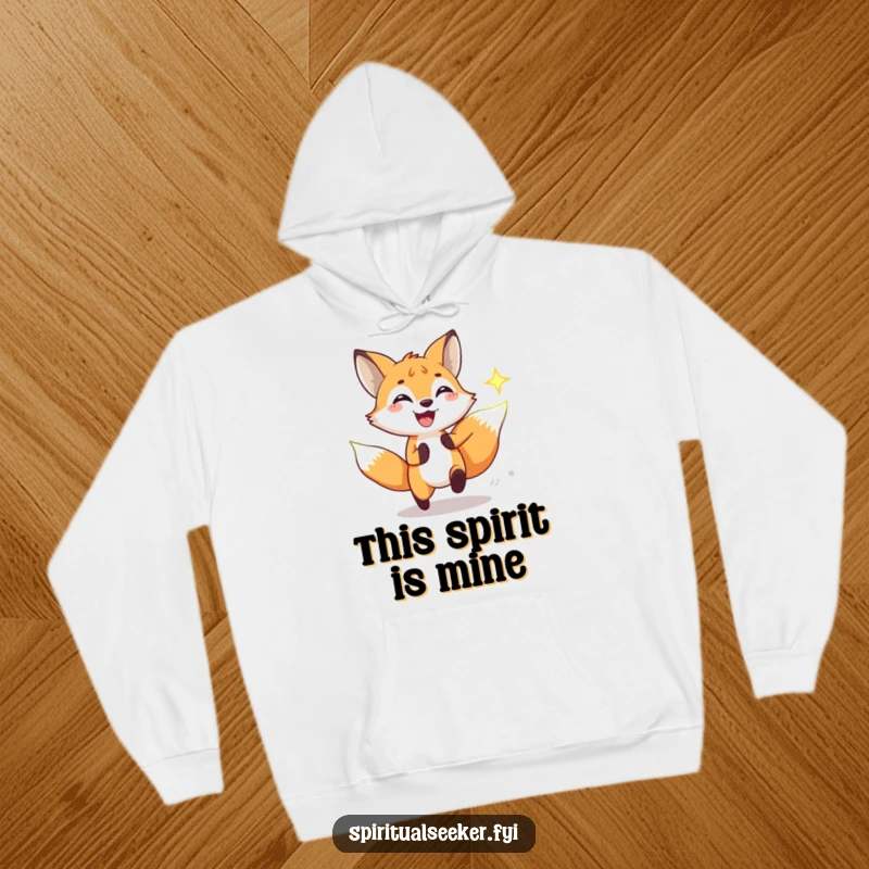 Funny hoodie depicting a joyous fox in hot pursuit of a glowing spiritual symbol, radiating playful energy and humorous determination.