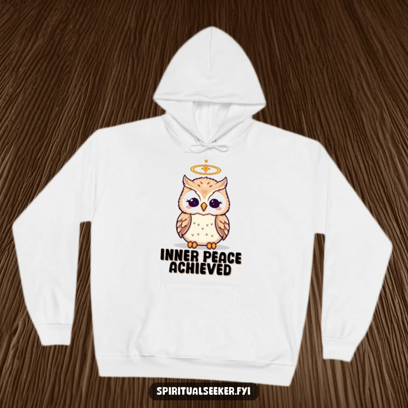 Funny cozy hoodie featuring a wise, meditating owl with a small halo, perfect for humorous relaxation.