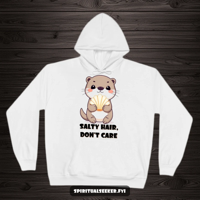 Funny playful otter hoodie, featuring an otter joyfully holding a radiant seashell. Offers warmth, comfort, and a touch of seaside humor.