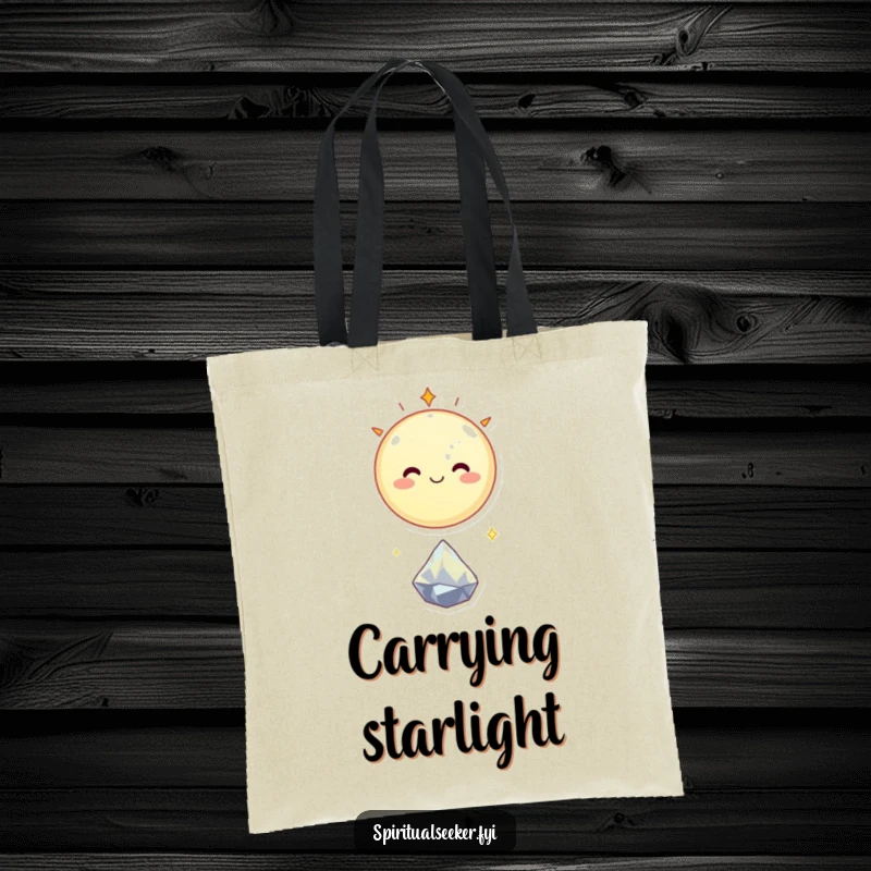 Funny tote bag showcasing a smiling celestial body floating happily above a tiny, sparkling crystal, adding cosmic fun.